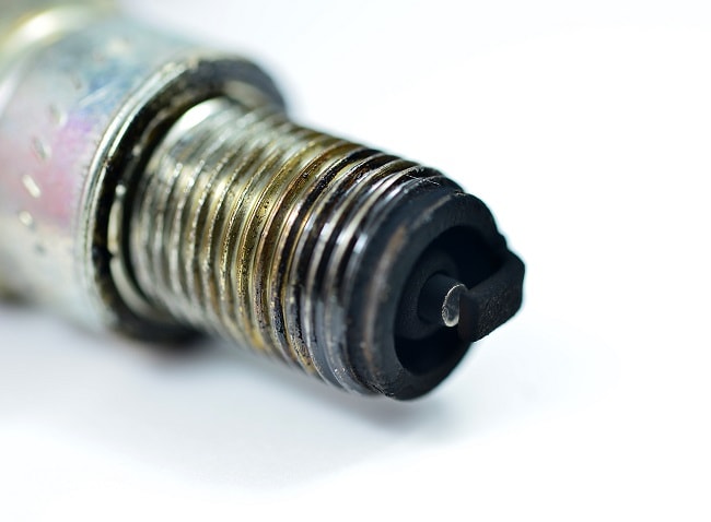 Carbon deposits on the spark plugs and cracks in the high-voltage wire