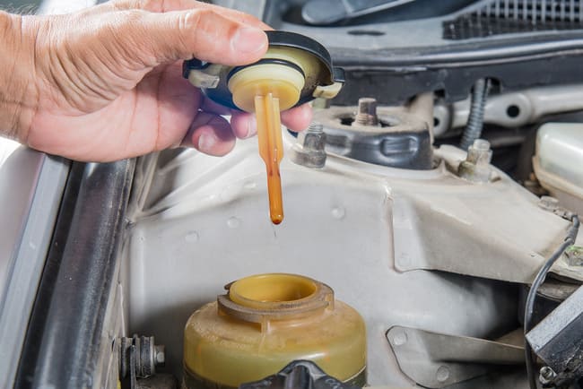 Symptoms of a failing power steering system: low fluid levels in the reservoir